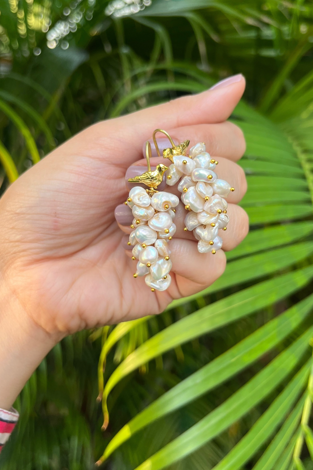 WHITE ASYMMETRICAL PEARL BUNCH BIRD EARRINGS