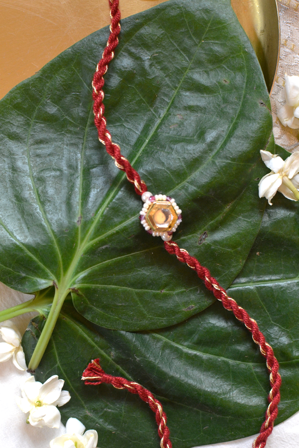 KUBERA LUMBA RAKHI SET- RED