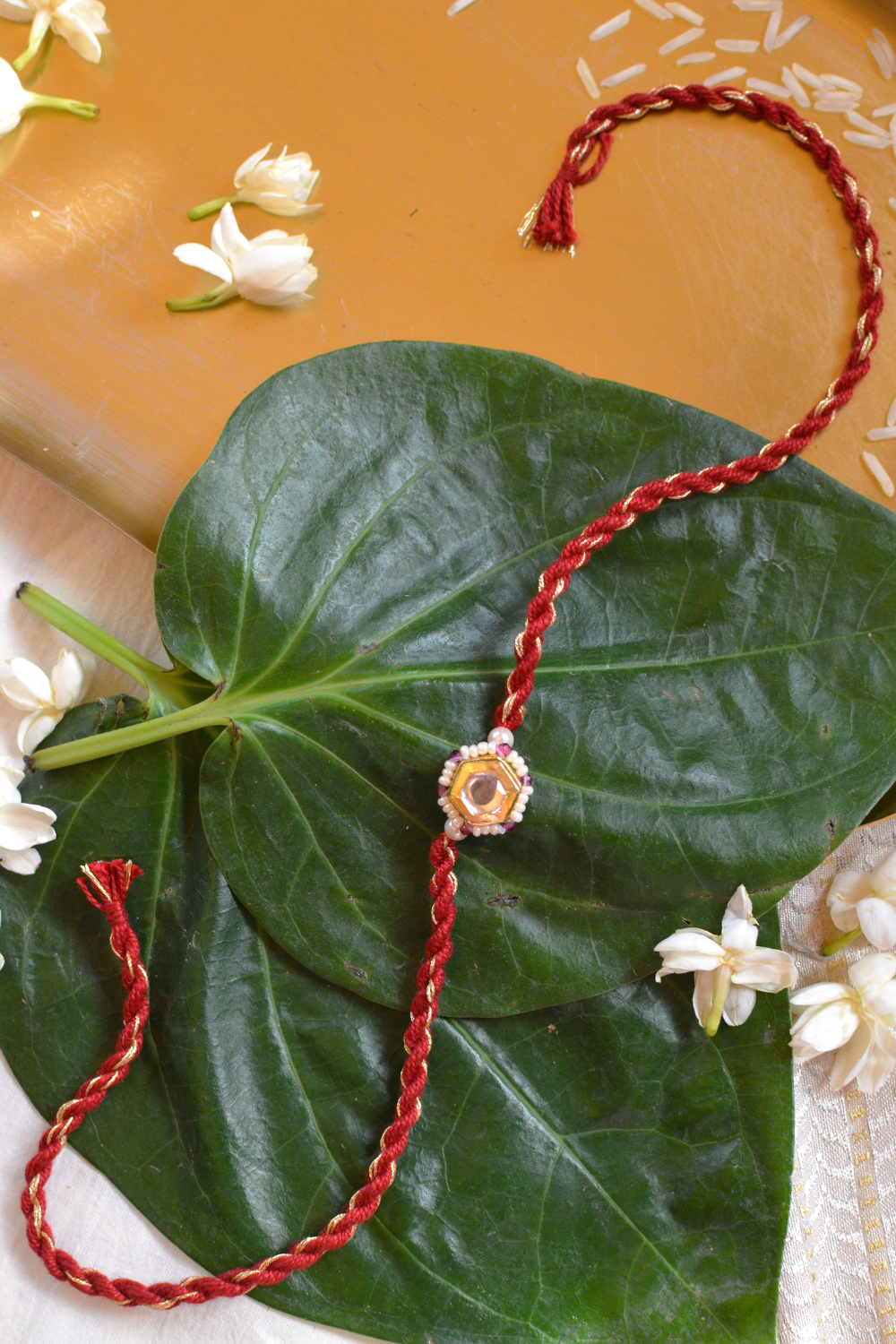 KUBERA LUMBA RAKHI SET- RED