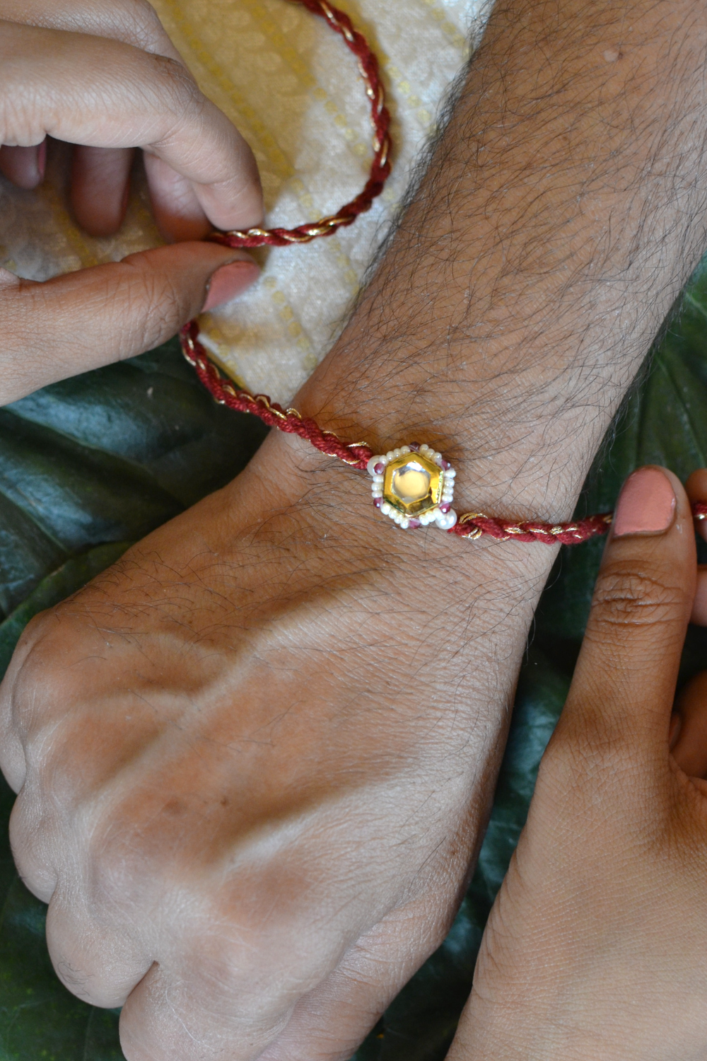 KUBERA LUMBA RAKHI SET- RED