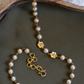 COPPERISH-PEACH PEARL AND FLOWER CLOSE NECKLACE
