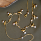 DIAMANTÉ AND GOLDEN BIRD CLOSE NECKLACE- PINK PEARLS