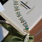 KUNDAN JHUMKAS & GREEN TASSEL BRACELET SET