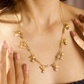 DIAMANTÉ AND GOLDEN BIRD CLOSE NECKLACE- PINK PEARLS